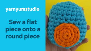 How to Sew a flat piece onto a round piece in crochet